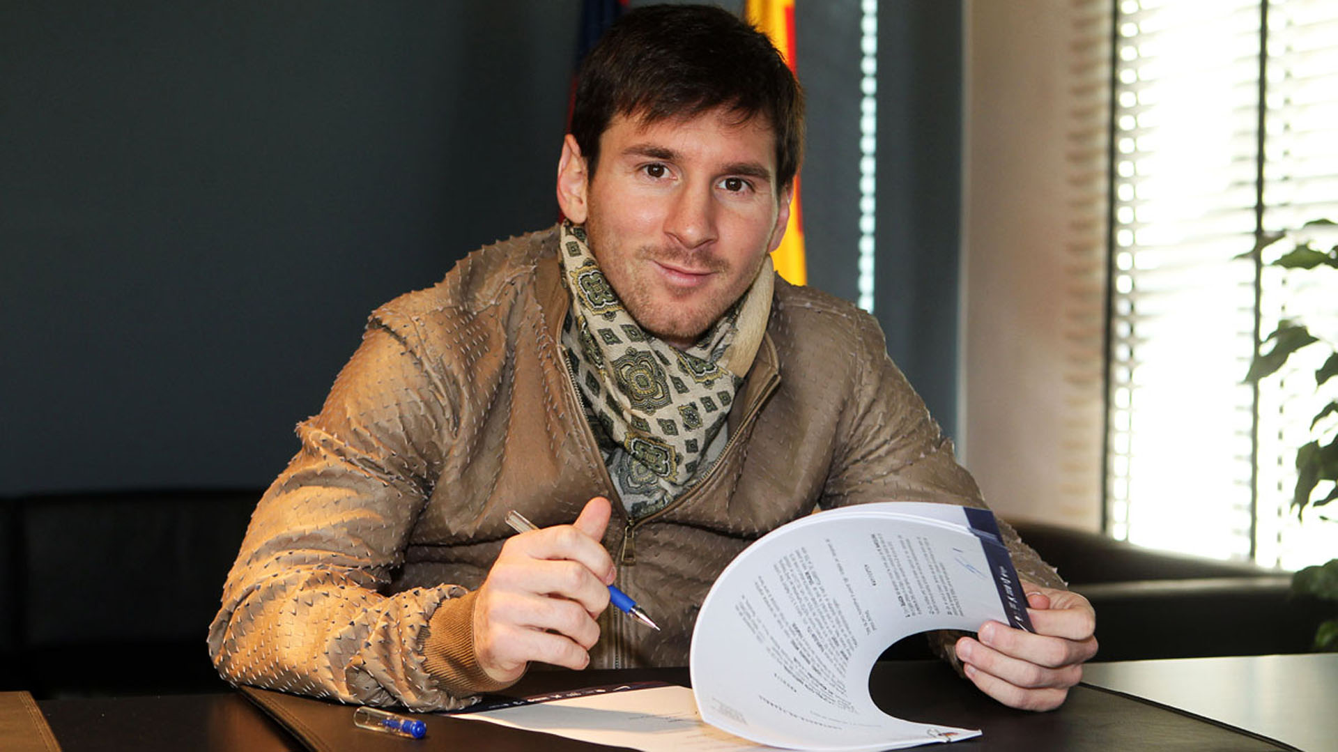 A handout picture taken and released on February 7, 2013 by FC Barcelona shows Barcelona's Lionel Messi signing his new contract with the Catalan club at the Camp Nou Stadium in Barcelona. Lionel Messi has signed a new contract that will tie him to Barcelona until 2018, the club announced today.  AFP PHOTO / FC BARCELONA / MIGUEL RUIZ
RESTRICTED TO EDITORIAL USE - MANDATORY CREDIT "AFP PHOTO / FC BARCELONA / MIGUEL RUIZ" - NO MARKETING NO ADVERTISING CAMPAIGNS - DISTRIBUTED AS A SERVICE TO CLIENTS